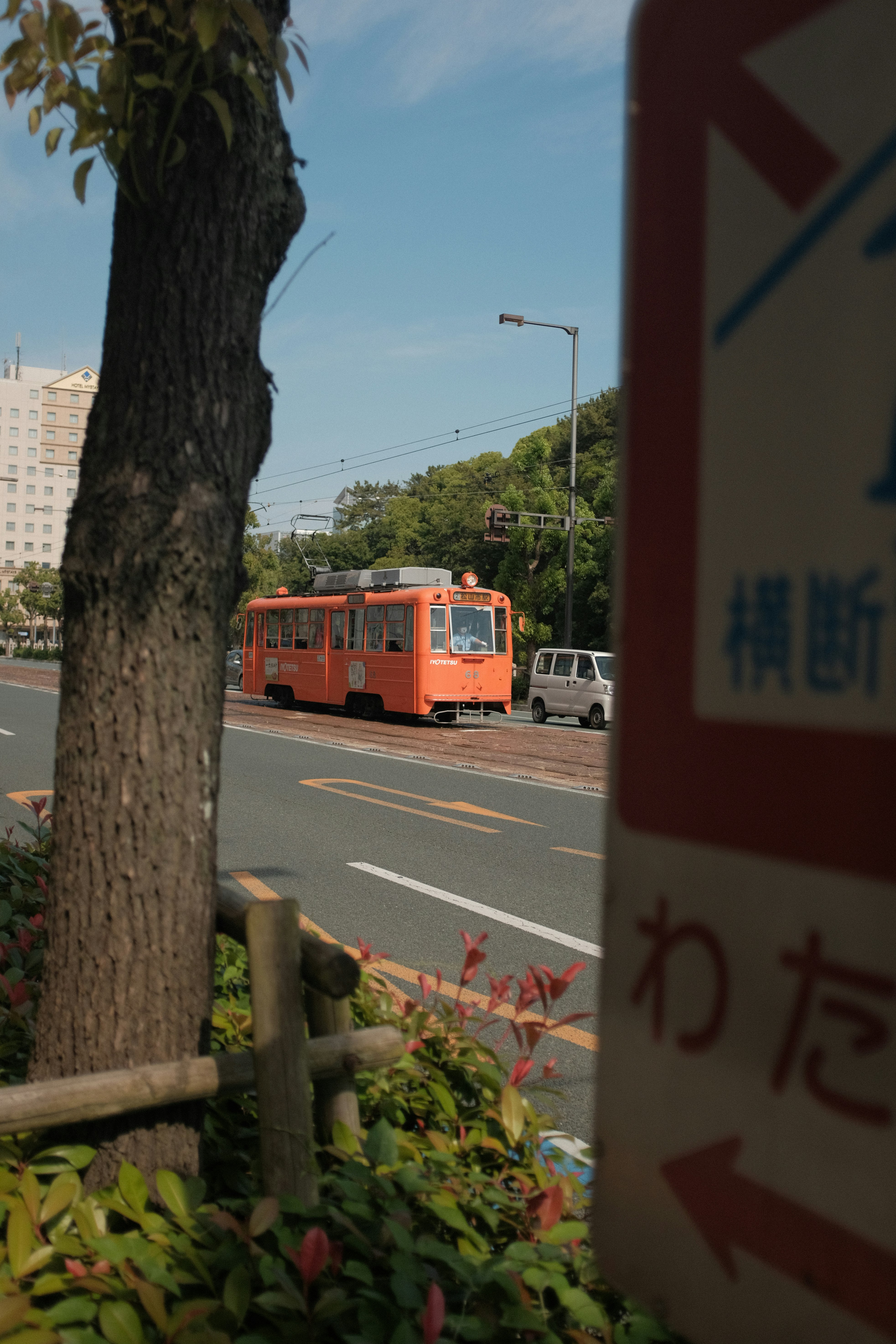 red and white bus on road during daytime